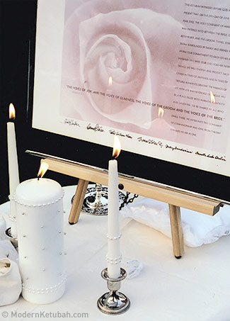A ketubah with a unity candle in an interfaith ceremony